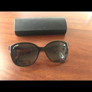 PRADA cat eye sunglasses in black.